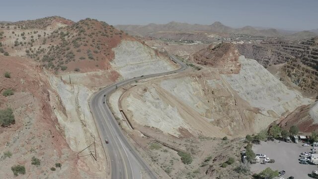 Aerial view of a road leading to the Copper Queen Mine near Bisbee Arizona. The rock is colorful and layered with sediment textures. 