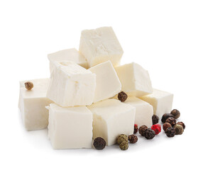 Pieces of delicious feta cheese with peppercorn on white background