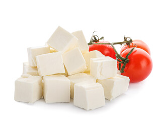 Pieces of delicious feta cheese with tomato cherry on white background