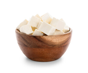 Wooden bowl with pieces of feta cheese on white background
