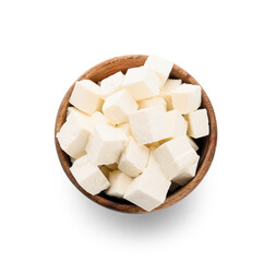 Wooden bowl with pieces of feta cheese on white background
