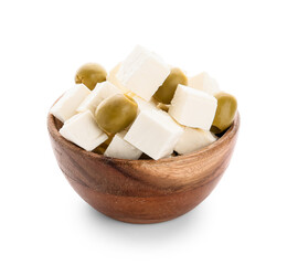 Wooden bowl with pieces of feta cheese and green olives on white background