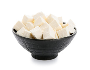 Bowl with pieces of feta cheese on white background