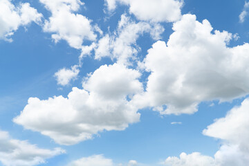 Fototapeta na wymiar Blue sky with beautiful natural white clouds. Space for text. Background.