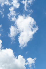 Blue sky with beautiful natural white clouds. Space for text. Background.