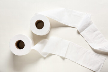 Rolls of toilet paper on light background