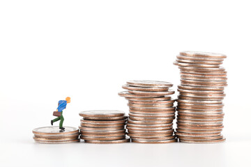 Increasing coins and a doll running up on a white background