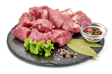 Raw pork pieces, ingredients for goulash, close-up, isolated on white background