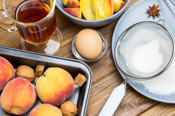Ripe peaches in metal tray.