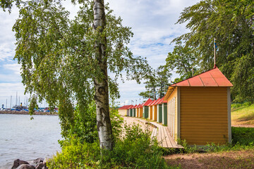 Fototapeta na wymiar Beach with colorful huts in the city Hjo in Sweden