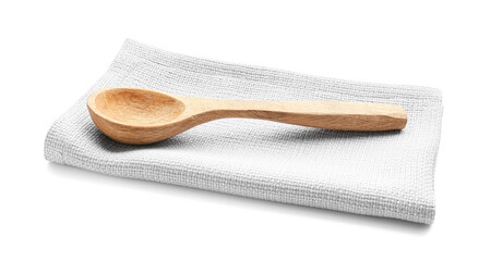 Fabric napkin and wooden spoon on white background