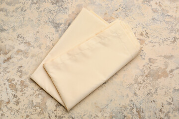 Fabric napkin on grunge background