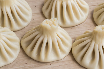Georgian traditional food khinkali on the plate in restaurant, ready to eat, hot dish.