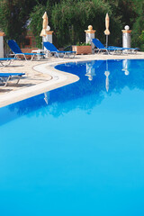 swimming pool at sunny hotel