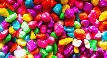 Fototapeta na wymiar Background and wallpaper of multi-colored small bright stones. Colored sweet multicolored sweets