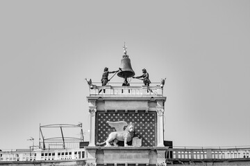 famous clocktower of venice with the old city flag and the lion, venice, Italy