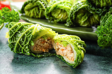 Stuffed cabbage leaf on color background, closeup