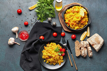 Composition with tasty pilaf on dark background