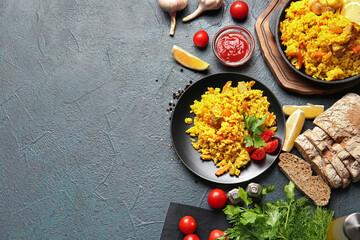 Composition with tasty pilaf on dark background