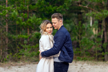 Happy loving couple enjoying of happiness love and tenderness, dating, romance.Couple hugging in love at spring park.