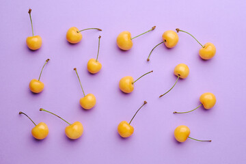 Tasty sweet cherries on color background