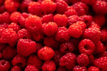 Ripe, juicy, tender and sweet raspberries as a background photo