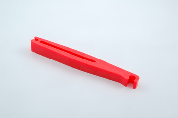 Red plastic clip tool for car repair and emergency