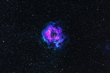 Horizontal background with Rosette Nebula for scientific publications, articles, design and photomontage. Stylish purple-blue nebula on the background of deep black space