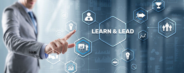 Learn and Lead. Businessman presses hand on the virtual screen inscription