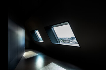 dark room with window viev over modern city