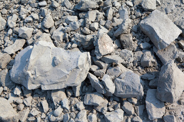 Clay Deposit, Raw Material Background – Clay Soil with Pebbles and Cracks, Rifts – Stone Mine Pit, Excavation Point of Natural Resource for Manufacturing of Beauty and Health Products