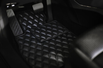 leather floor mat with diamond shape texture. eco leather luxury floor mat on the front row car...