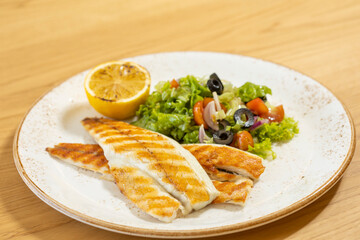 Grilled chicken fillet served with mixed salad