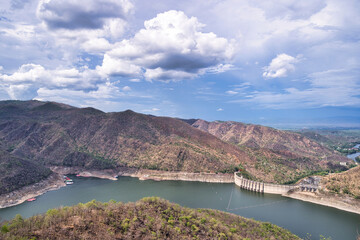 Obraz na płótnie Canvas Big Bhumibol Dam Viewpoint, Middle Mountain and Blue Sky, Arched Concrete Dam, Hydroelectric Generator