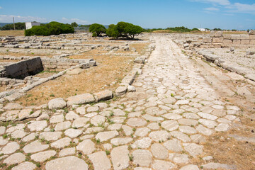 Ancient Roman road in the archaeological site of Egnatia. Puglia, Italy