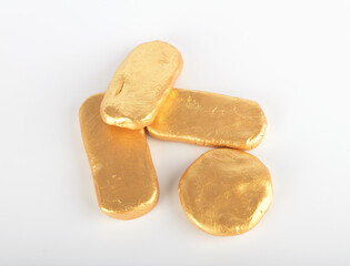Gold bars and golden pie on white background