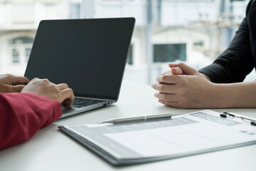 Business people hold a resume and talk to work applicants for work interviews about careers and Their personal history in the company. Recruitment concepts