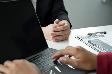 Business people hold a resume and talk to work applicants for work interviews about careers and...