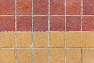 Fototapeta premium Brown terra cotta floor tiles outside the building pattern and background seamless