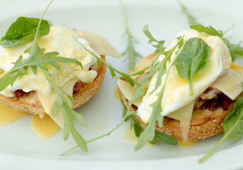 Eggs Benedict and green leafs