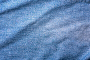 Plakat Old Blue jeans fabric denim texture background for design. Canvas denim. Close up view.