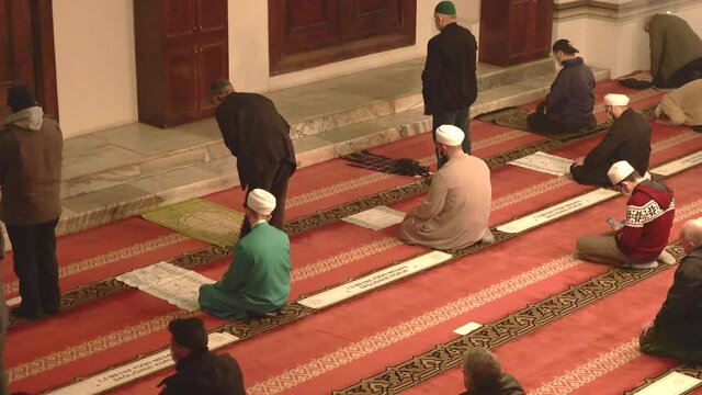 Muslim eid congregation praying.Mosque teacher imam is reading the Quran.Reads Qur'an interior god religion mysterious religious islam moslem place of worship prayer temple azan salaah spirituality 4K