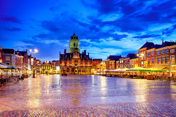 Dutch Travel Concepts. Unique Stadhuis (Known as City Hall) at Local Markt Square (Market Place)  in Dutch Old City Delft during Blue Hour, in Holland, the Netherlands.