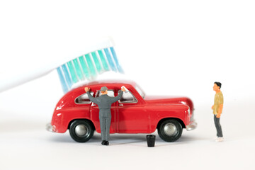 Cleaning red car on white background