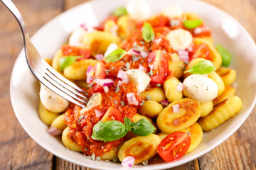 gnocchi with tomato sauce and mozzarella - obrazy, fototapety, plakaty