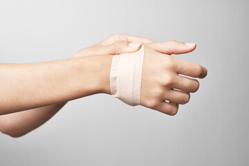 bandaged arm joint pain treatment medicine close-up