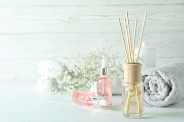 Aromatic concept with diffuser on white wooden table