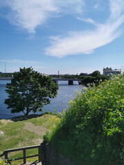 View of the bridge of the city of Vyborg from the wall of the Vyborg Castle against the blue sky.