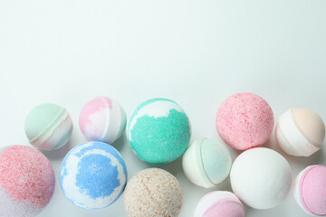 Different bath balls on white background, top view