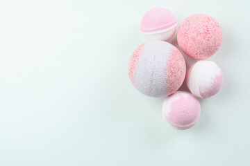 Pink bath balls on white background, space for text